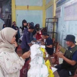 Pemerintah Desa Cisaat Salurkan 1.440 Paket Bantuan Pangan dari BULOG kepada Masyarakat